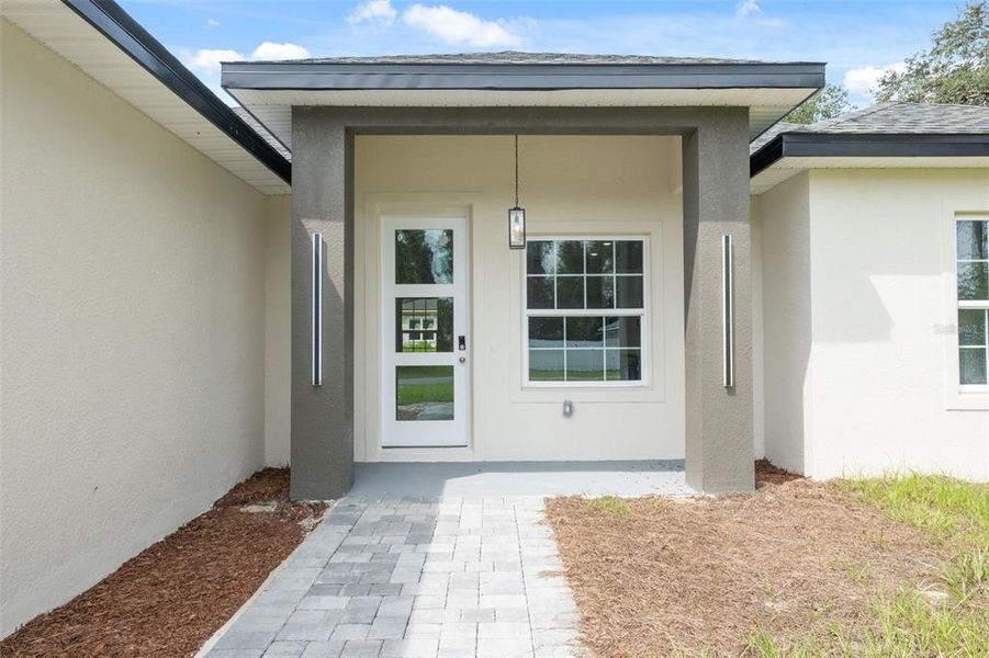 Front exterior of a new home in , Ocala, FL, highlighting curb appeal (Image 17).