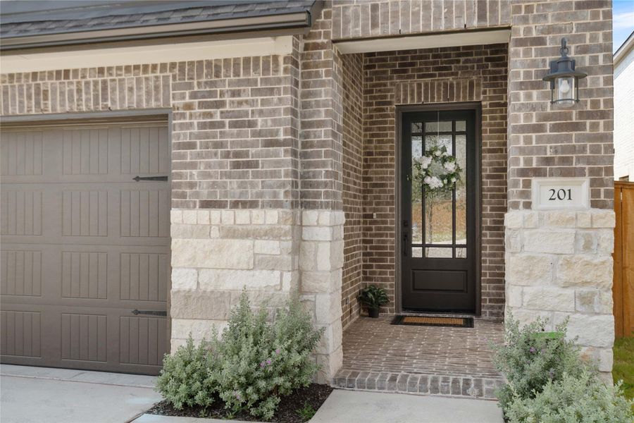 Views of the chic front door and secluded front porch.