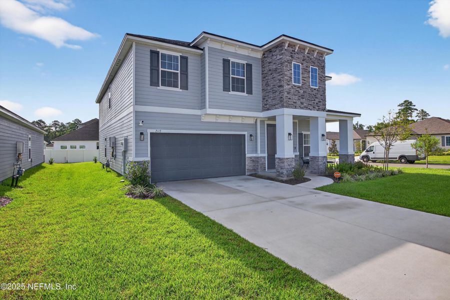 Front exterior of a new home in , Middleburg, FL, highlighting curb appeal (Image 23).