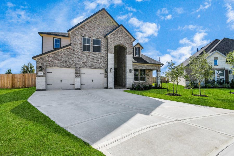 The residence features a practical 2-car garage complemented by a generous driveway, ensuring abundant space for parking needs. The residence features a practical 2-car garage complemented by a generous driveway, ensuring abundant space for parking needs.