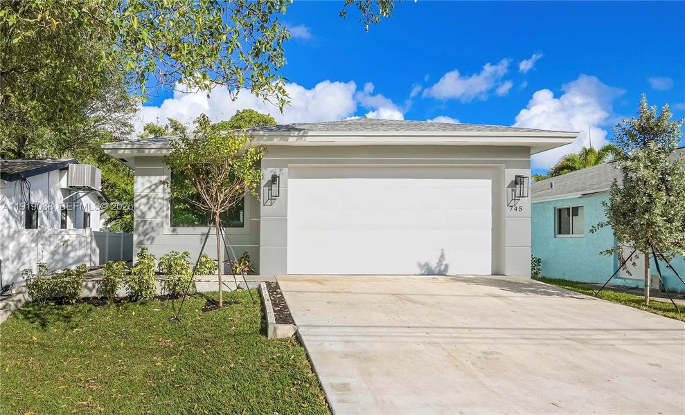 Front exterior of a new home in , Oakland Park, FL, highlighting curb appeal (Image 20). Front exterior of a new home in , Oakland Park, FL, highlighting curb appeal (Image 20).