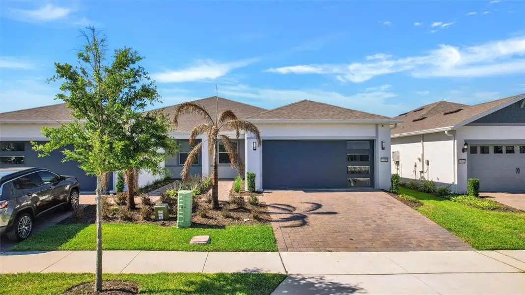 Front exterior of a new home in , Winter Garden, FL, highlighting curb appeal (Image 2). Front exterior of a new home in , Winter Garden, FL, highlighting curb appeal (Image 2).