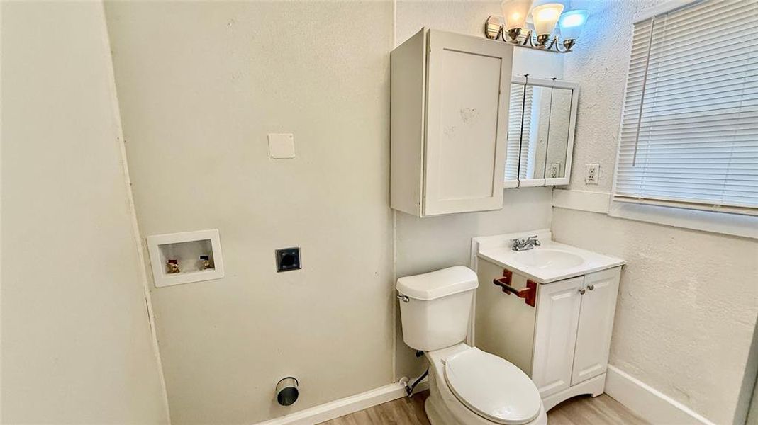 Bathroom with washer and dryer hookup.