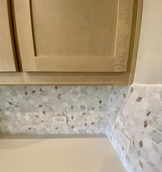 Champagne stained shaker cabinet color is all the rage. Matched with Diego Gold Quartz which is white with soft Champagne colored veins running through it. Tied together by decorative mosaic tile backsplash. Champagne stained shaker cabinet color is all the rage. Matched with Diego Gold Quartz which is white with soft Champagne colored veins running through it. Tied together by decorative mosaic tile backsplash.