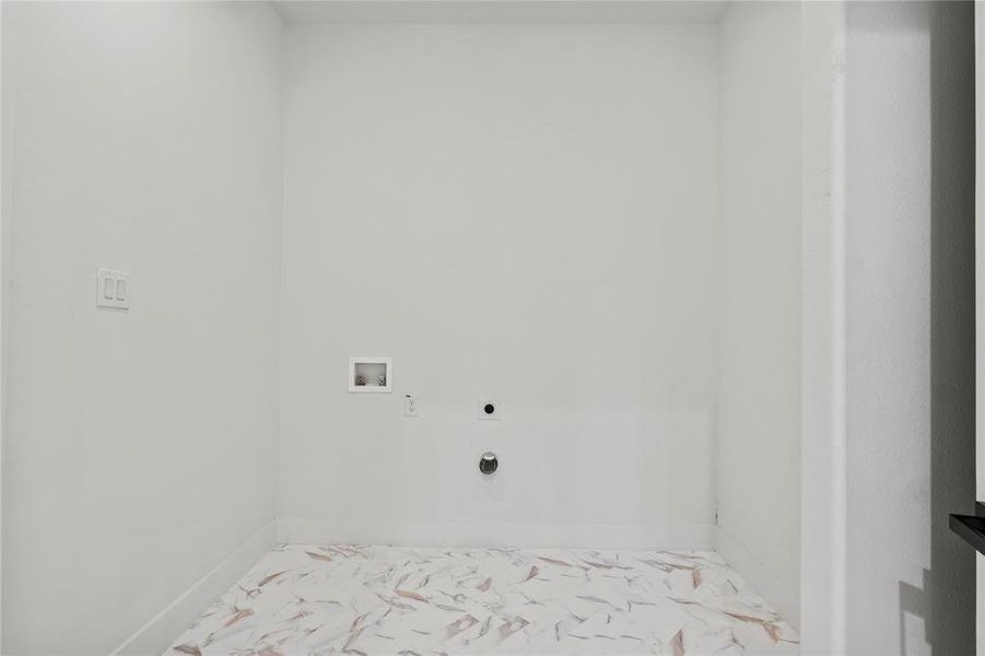 Washroom featuring marble look tile flooring, washer hookup, and electric dryer hookup