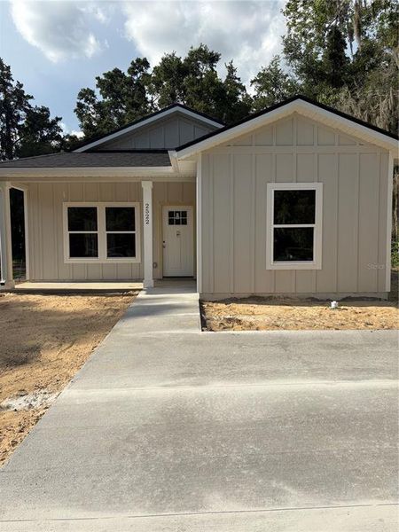 Front exterior of a new home in , Gainesville, FL, highlighting curb appeal (Image 1).