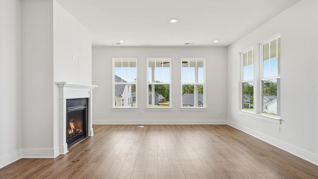 Notable family room designed with high standards—perfect for both everyday living and entertaining located at Iris Meadows Notable family room designed with high standards—perfect for both everyday living and entertaining located at Iris Meadows