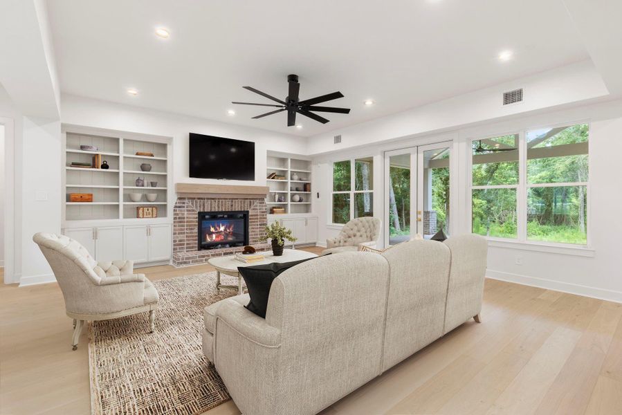 Beautiful brick fireplace with floating mantle and custom shelving and cabinetry provide a beautiful focal point. Beautiful brick fireplace with floating mantle and custom shelving and cabinetry provide a beautiful focal point.