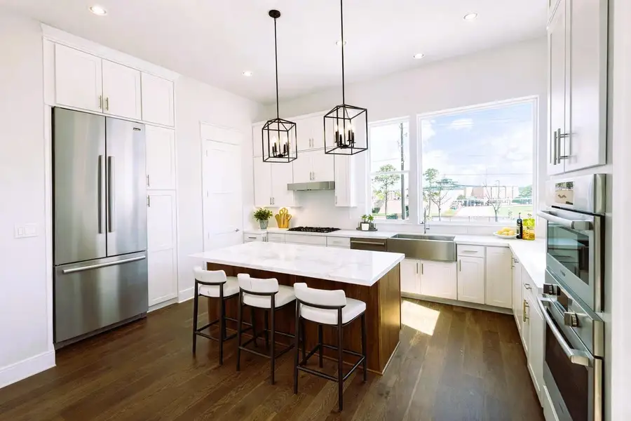 Bright Kitchen w/ Premium Bosch Appliances, Soft Close  and Stacked Cabinets (picture was virtually staged.  Fridge was virtually staged as well)