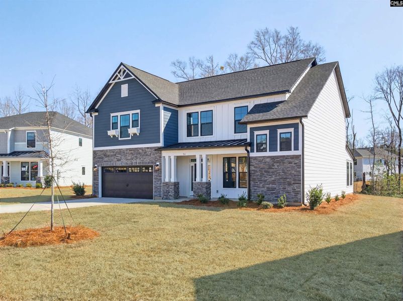 Front exterior of a new home in Collins Cove, Chapin, SC, highlighting curb appeal (Image 2).