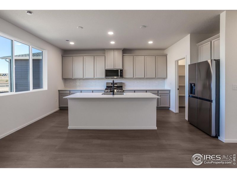Furnished interior view inside a new home in Bloom Trailblazer Collection - Single Family Homes, Fort Collins (Image 6).