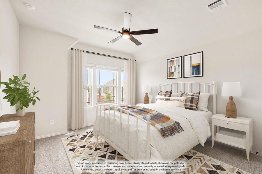 Bedroom with white iron bed frame, ceiling fan, carpet flooring, and large windows with sheer curtains Bedroom with white iron bed frame, ceiling fan, carpet flooring, and large windows with sheer curtains