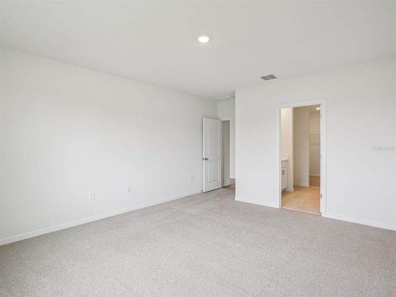 Spacious, unfurnished interior of a new home in The Grove at Stuart Crossing - Classic Series, Bartow (Image 16).