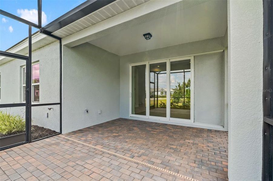 Exterior details and patio area of a home in Wysteria, Venice (Image 28).