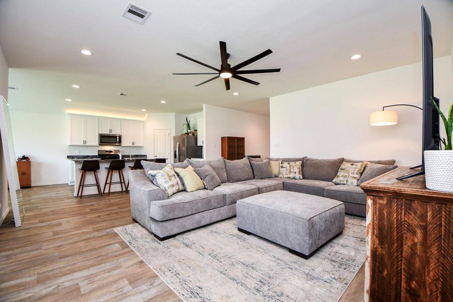 The open concept living area allows you to entertain your guests while cooking in your generous kitchen.