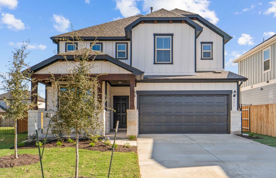 Front exterior of a new home in Santa Rita Ranch, Liberty Hill, TX, highlighting curb appeal (Image 2). Front exterior of a new home in Santa Rita Ranch, Liberty Hill, TX, highlighting curb appeal (Image 2).