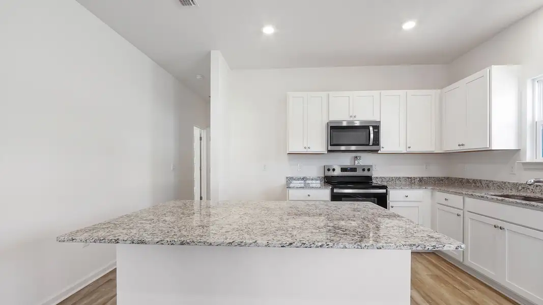 Furnished interior view inside a new home in Owl's Head East, Freeport (Image 5).