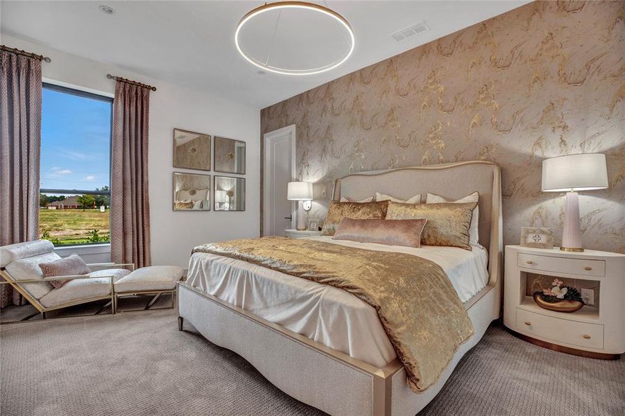 Bedroom featuring carpet floors and wallpapered walls Bedroom featuring carpet floors and wallpapered walls