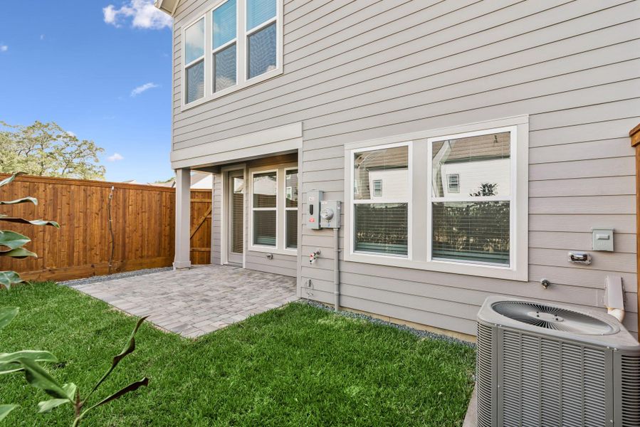 Exterior details and patio area of a home in Retreat at Oak Park, Houston (Image 3).