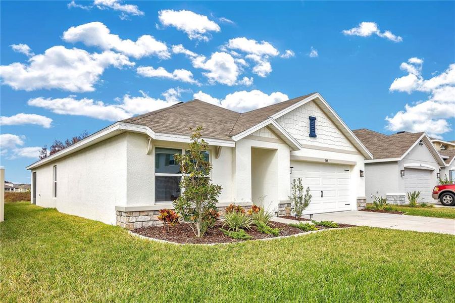 Front exterior of a new home in North Park Isle, Plant City, FL, highlighting curb appeal (Image 20).