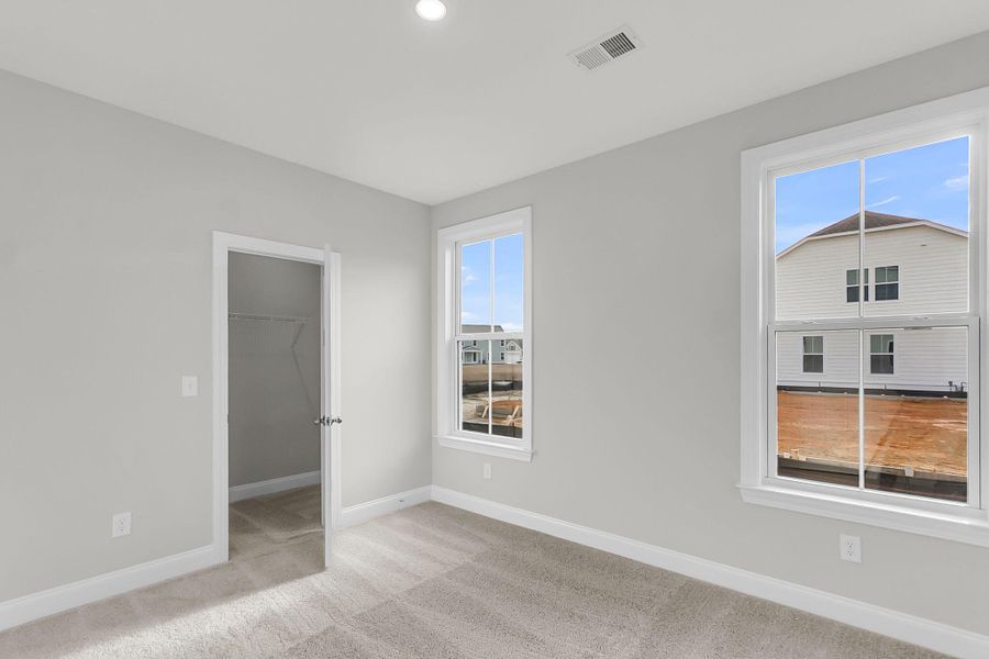Spacious, unfurnished interior of a new home in Tidewater at Lakes of Cane Bay, Summerville (Image 37).