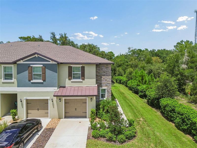 Front exterior of a new home in , Land O' Lakes, FL, highlighting curb appeal (Image 25).