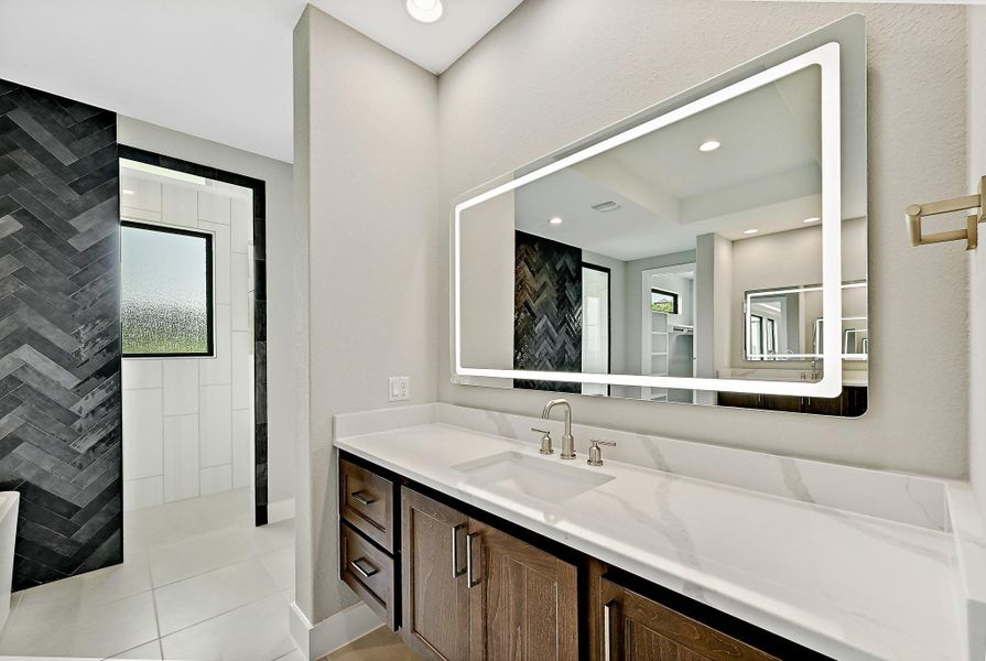 A well-lit bathroom vanity with a modern illuminated mirror and sleek fixtures provides a refreshing retreat. A well-lit bathroom vanity with a modern illuminated mirror and sleek fixtures provides a refreshing retreat.