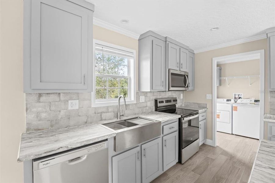 Furnished interior view inside a new home in , Okeechobee (Image 10).