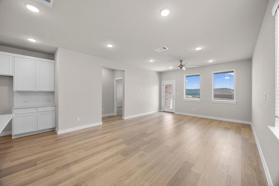 Blonde wood-style flooring and high ceilings amplify the open-concept design, perfect for daily living and entertaining. Blonde wood-style flooring and high ceilings amplify the open-concept design, perfect for daily living and entertaining.