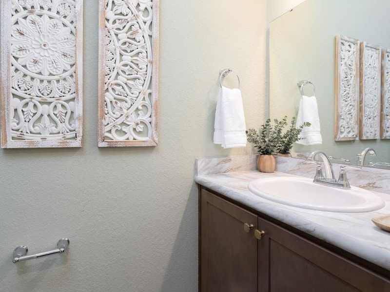 And, a convenient downstairs powder room is available for your guests - Wesley II by Highland Homes And, a convenient downstairs powder room is available for your guests - Wesley II by Highland Homes