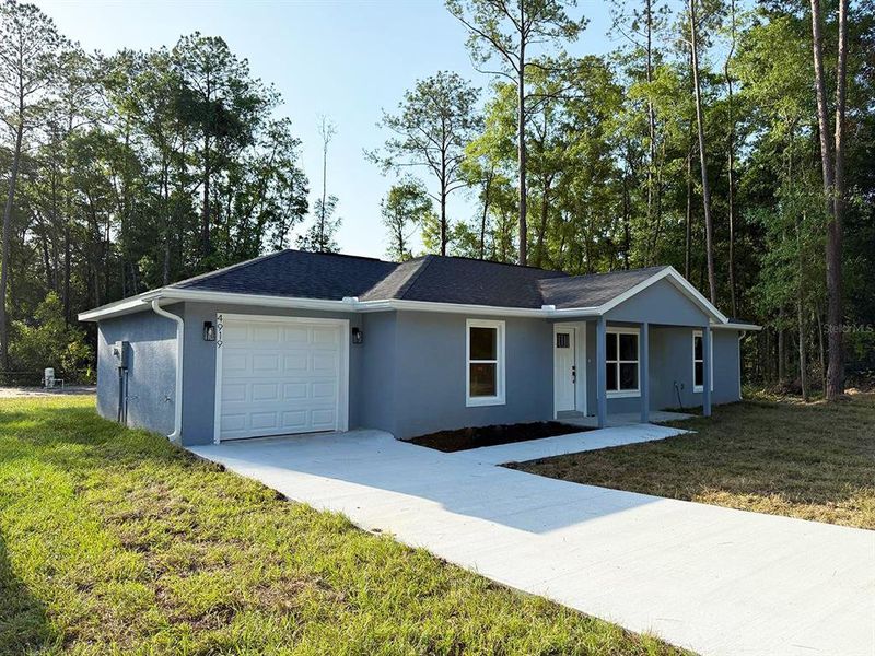 Front exterior of a new home in , Ocala, FL, highlighting curb appeal (Image 1). Front exterior of a new home in , Ocala, FL, highlighting curb appeal (Image 1).