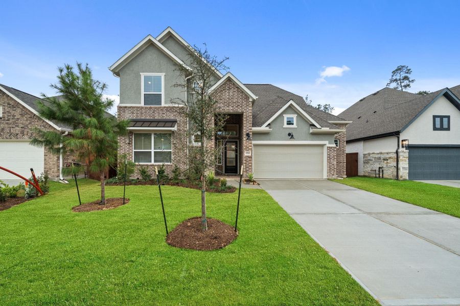 Front exterior of a new home in Evergreen, Conroe, TX, highlighting curb appeal (Image 23).