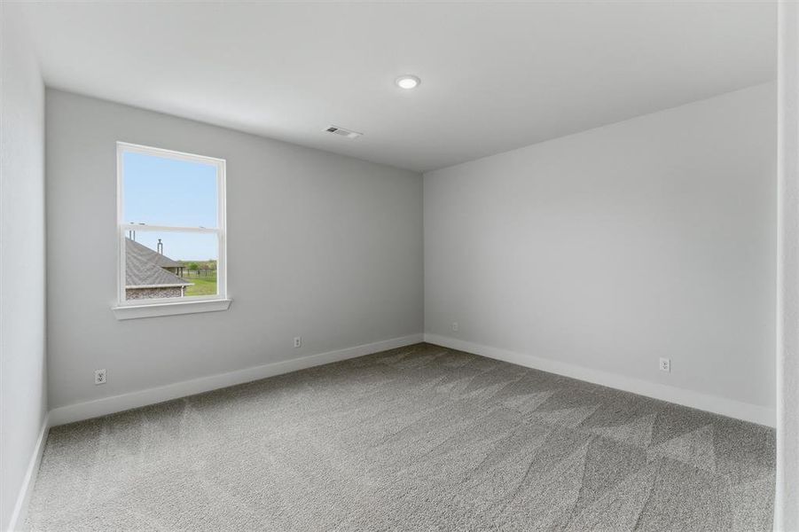 Unfurnished room with light carpet and baseboards