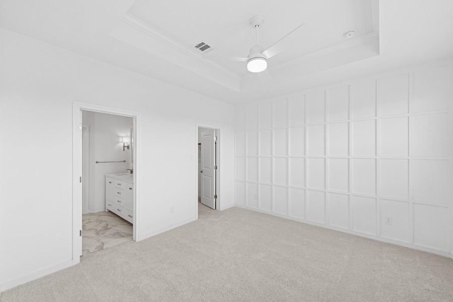 Secluded primary suite with feature wall