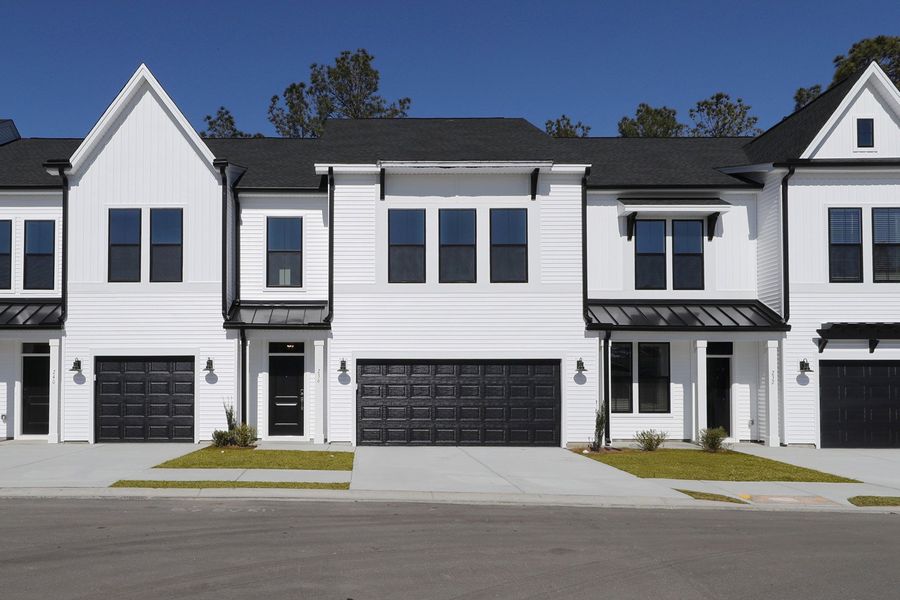 Front exterior of a new home in Bally Castle, Murrells Inlet, SC, highlighting curb appeal (Image 1). Front exterior of a new home in Bally Castle, Murrells Inlet, SC, highlighting curb appeal (Image 1).