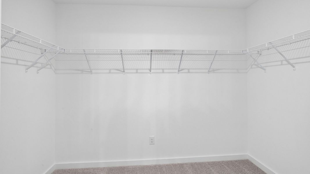Spacious walk-in closet for primary suite