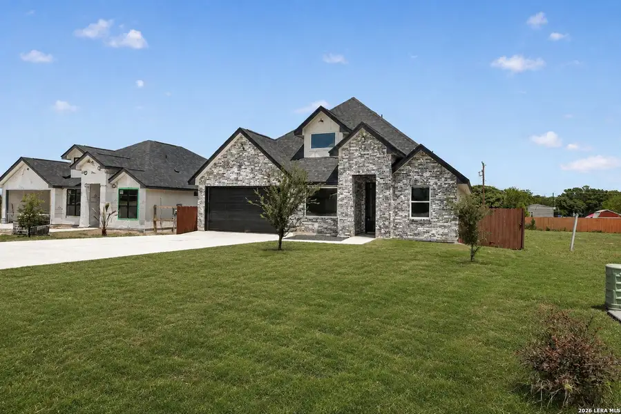 Front exterior of a new home in , Somerset, TX, highlighting curb appeal (Image 22).