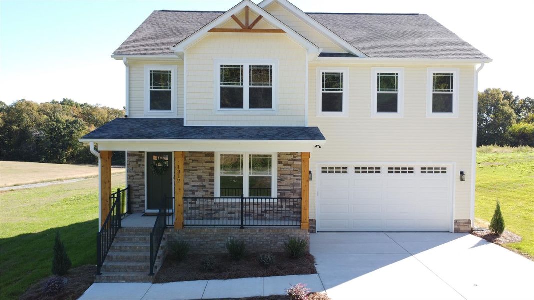 Front exterior of a new home in , Wingate, NC, highlighting curb appeal (Image 18).