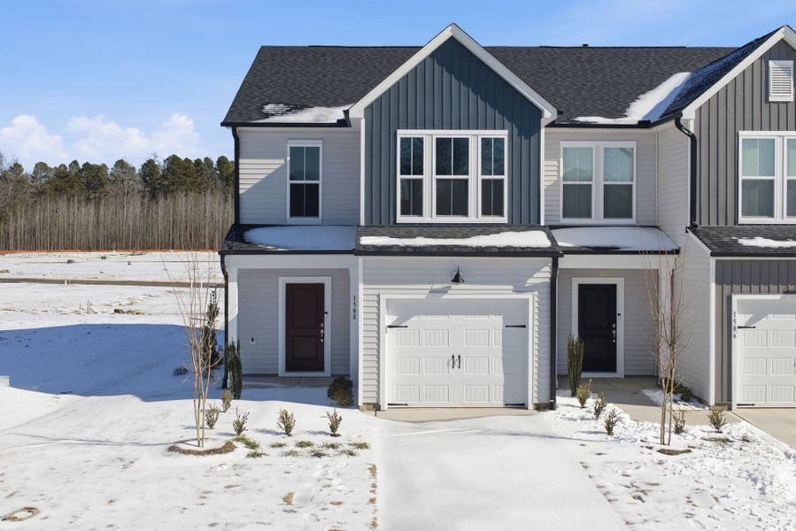 Front exterior of a new home in Poets Walk, Whitsett, NC, highlighting curb appeal (Image 30).
