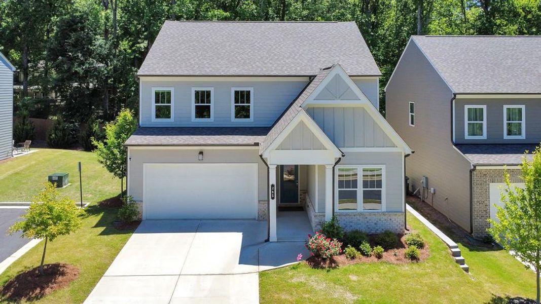 Front exterior of a new home in , Holly Springs, GA, highlighting curb appeal (Image 28). Front exterior of a new home in , Holly Springs, GA, highlighting curb appeal (Image 28).