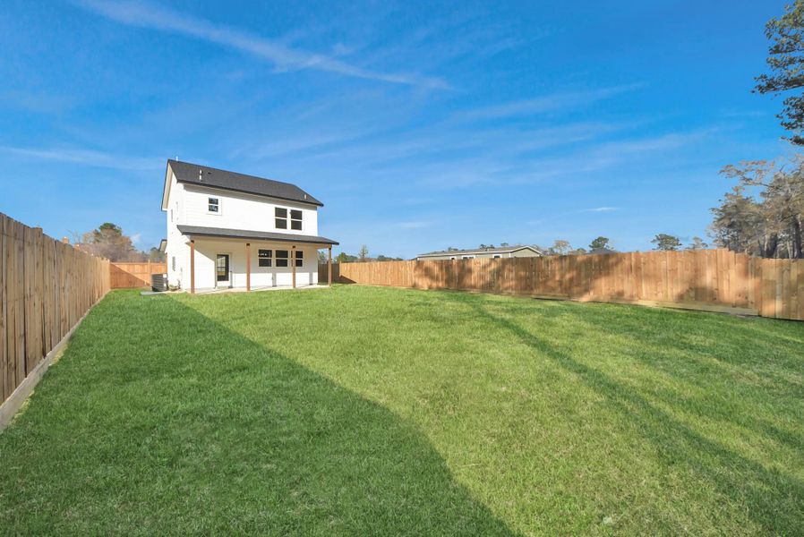 Exterior details and patio area of a home in , Conroe (Image 3).