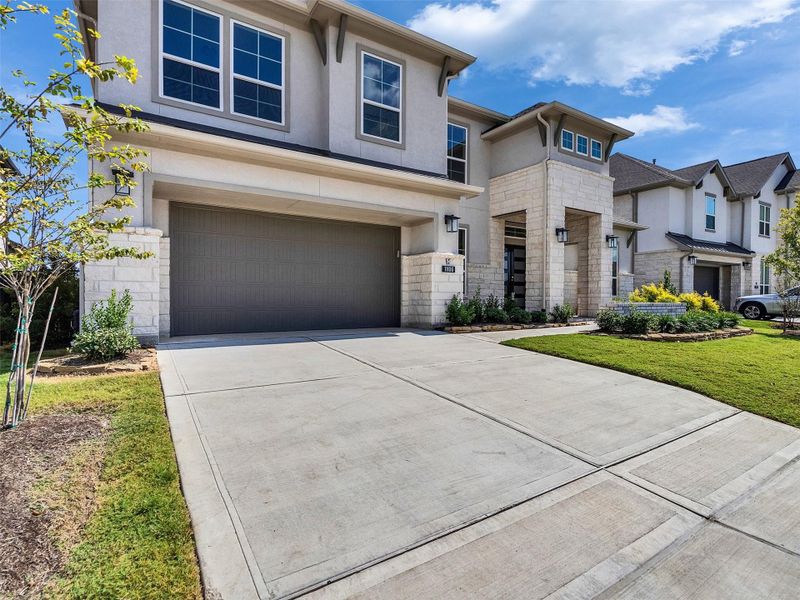 Front exterior of a new home in , Cypress, TX, highlighting curb appeal (Image 2). Front exterior of a new home in , Cypress, TX, highlighting curb appeal (Image 2).