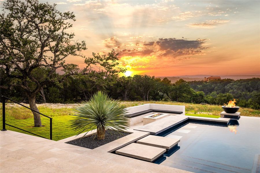 Surrounding community featuring a fire pit and a patio