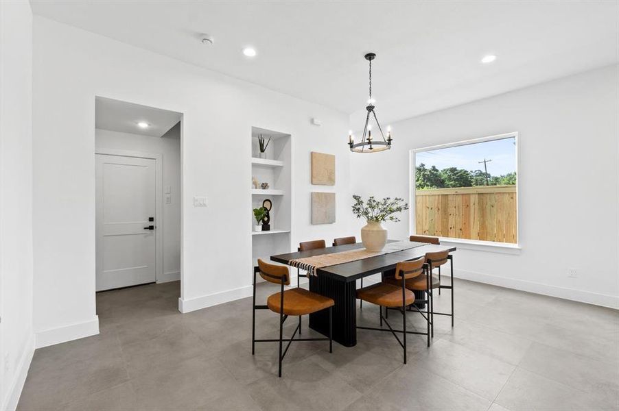 Custom built in cabinetry throughout the home, with a mudroom separating the kitchen and garage.