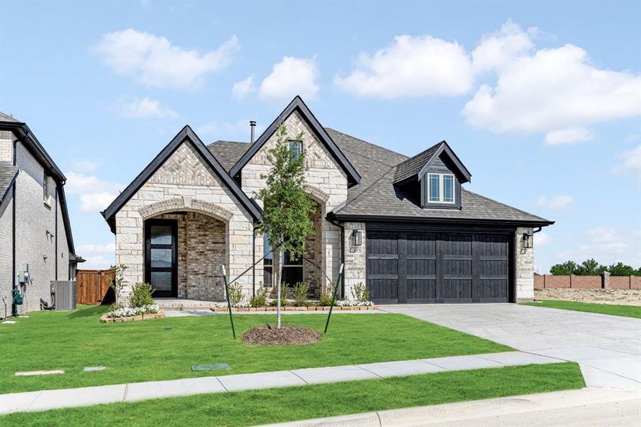 Front exterior of a new home in Devonshire, Forney, TX, highlighting curb appeal (Image 19).