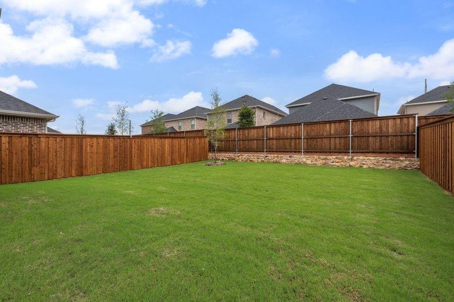 Exterior details and patio area of a home in Spiritas Ranch, Little Elm (Image 24).