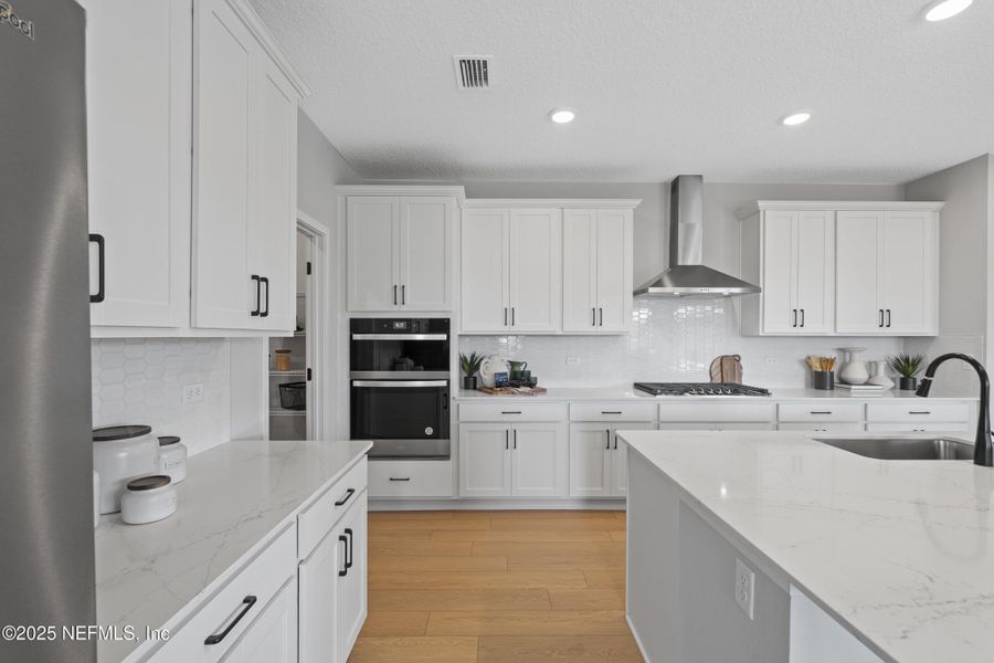 Furnished interior view inside a new home in The Cypress Series at Reserve East, Flagler Beach (Image 7).
