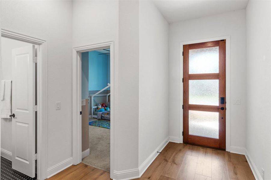 Entryway featuring light wood-style floors and baseboards