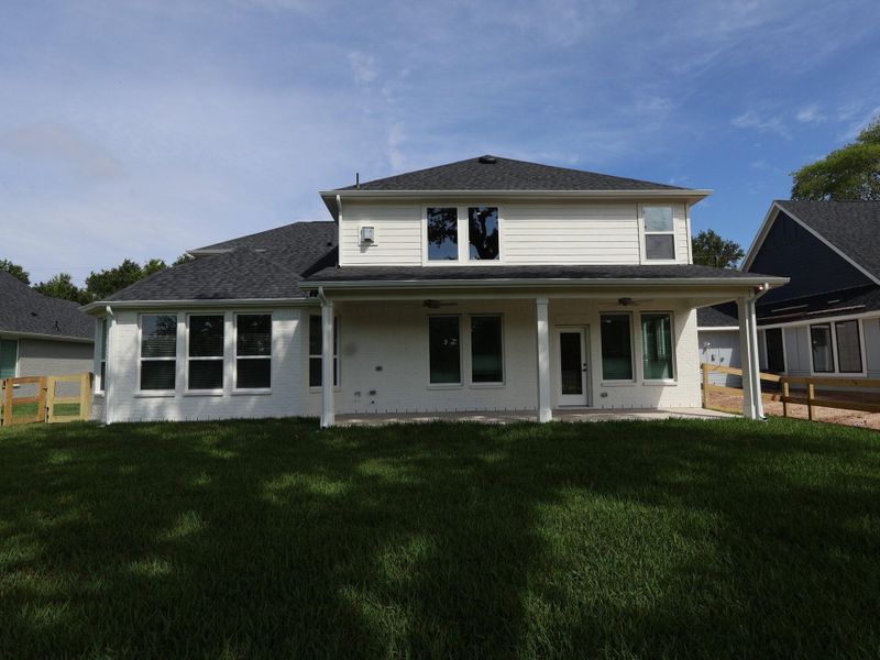 Exterior details and patio area of a home in The Oaks on 6th Street, Magnolia (Image 3).