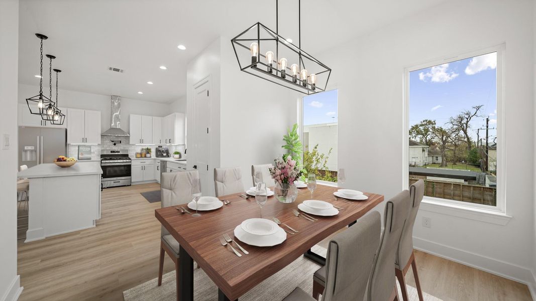 Virtually Staged: The dining room has direct access to the kitchen, and living space.